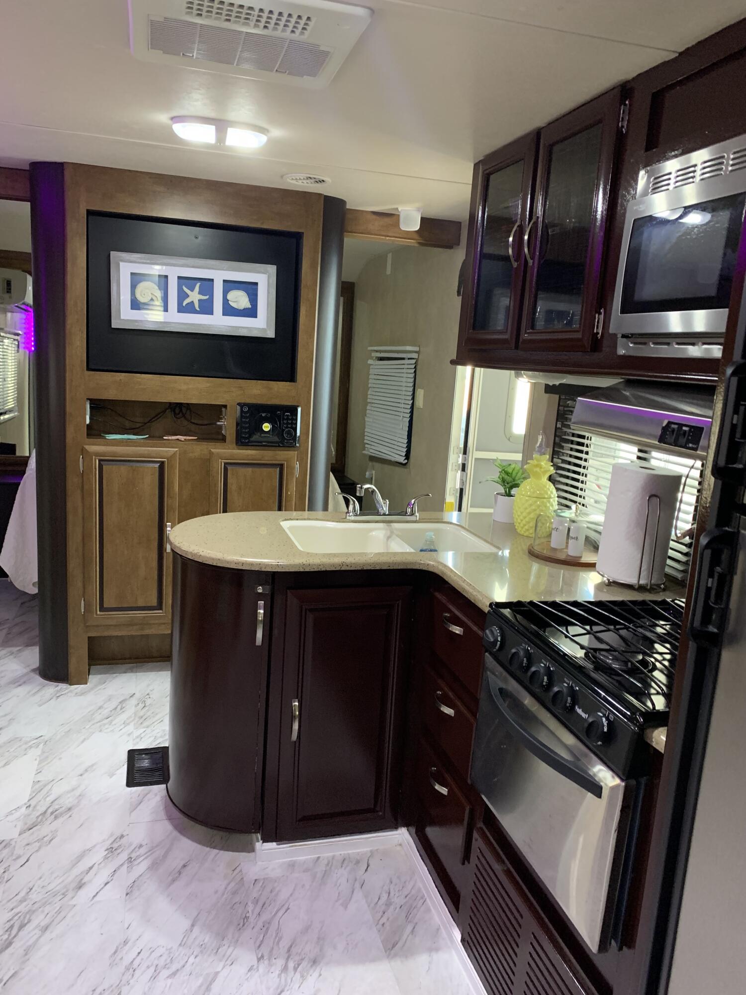 a kitchen with stainless steel appliances granite countertop a stove and a sink