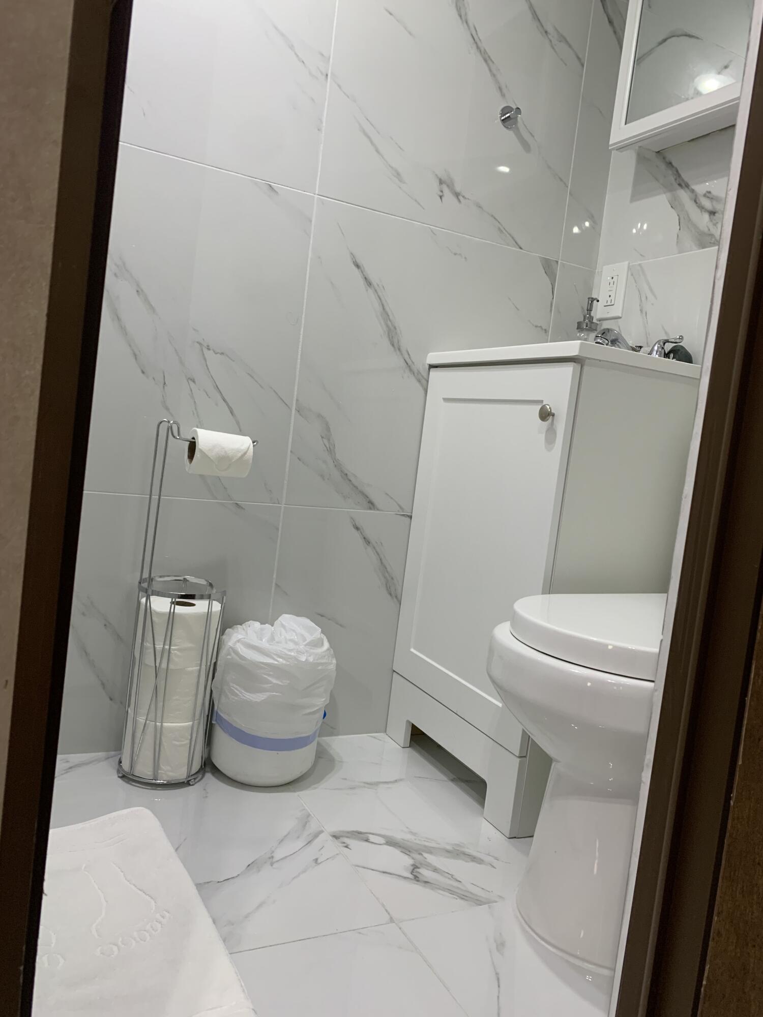 325 Calusa Street, Unit 120 Key Largo, FL 33037 - Photo 15 of 20 a bathroom with a toilet and a shower