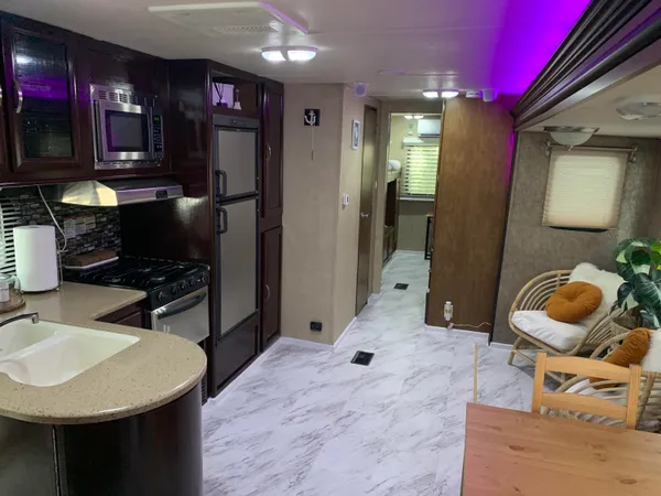 a bathroom with a sink a vanity and a mirror