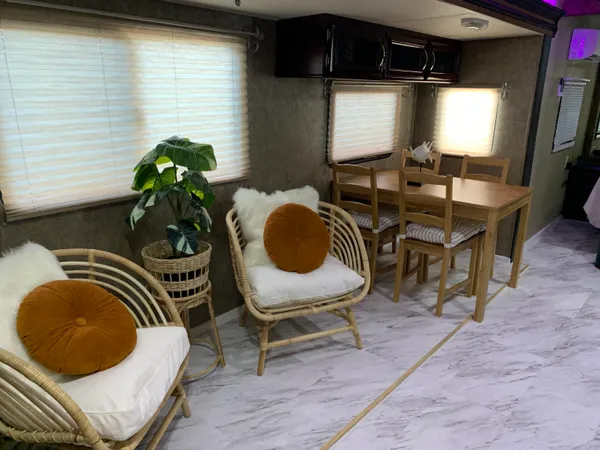 a dining room with furniture and window