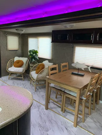 a view of a wooden table and chairs in patio