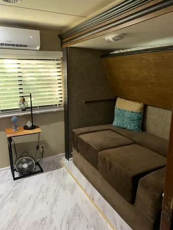 a bedroom with a bed and a night stand