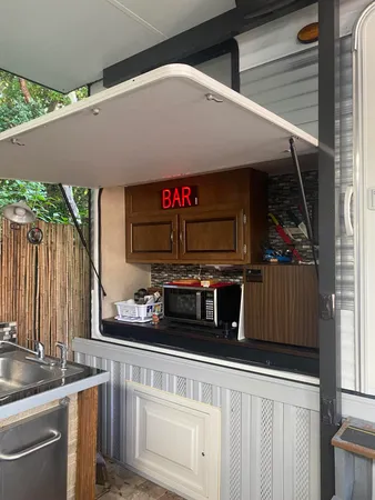 a close view of a sink a stove and dishwasher in a kitchen