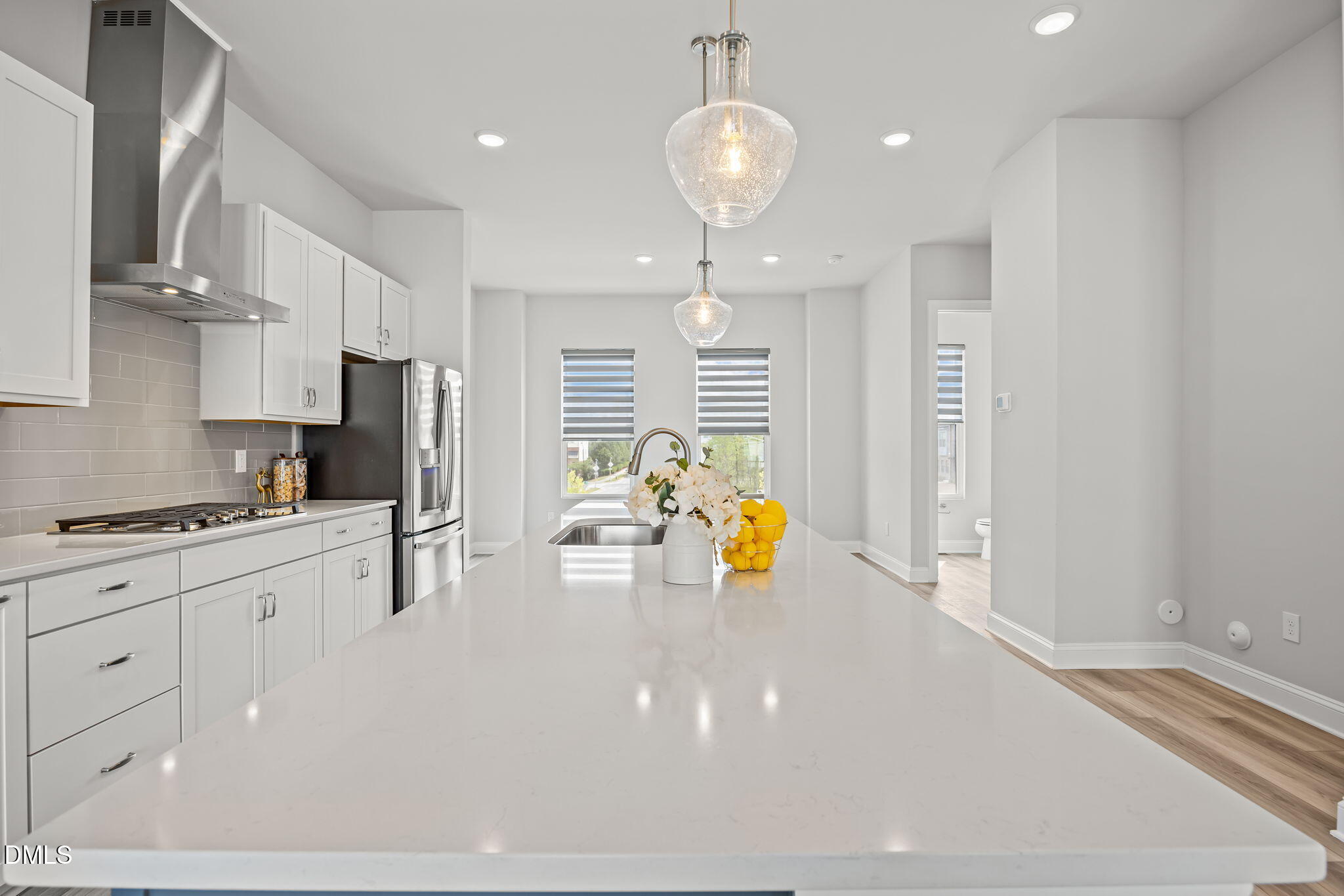 501 Hedrick Ridge Road Cary, NC 27519 - Photo 12 of 47 a kitchen with stainless steel appliances a refrigerator sink and white cabinets