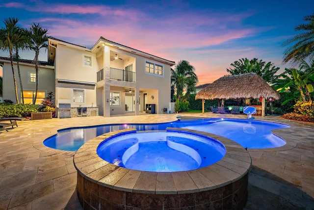 a view of a swimming pool with an outdoor seating