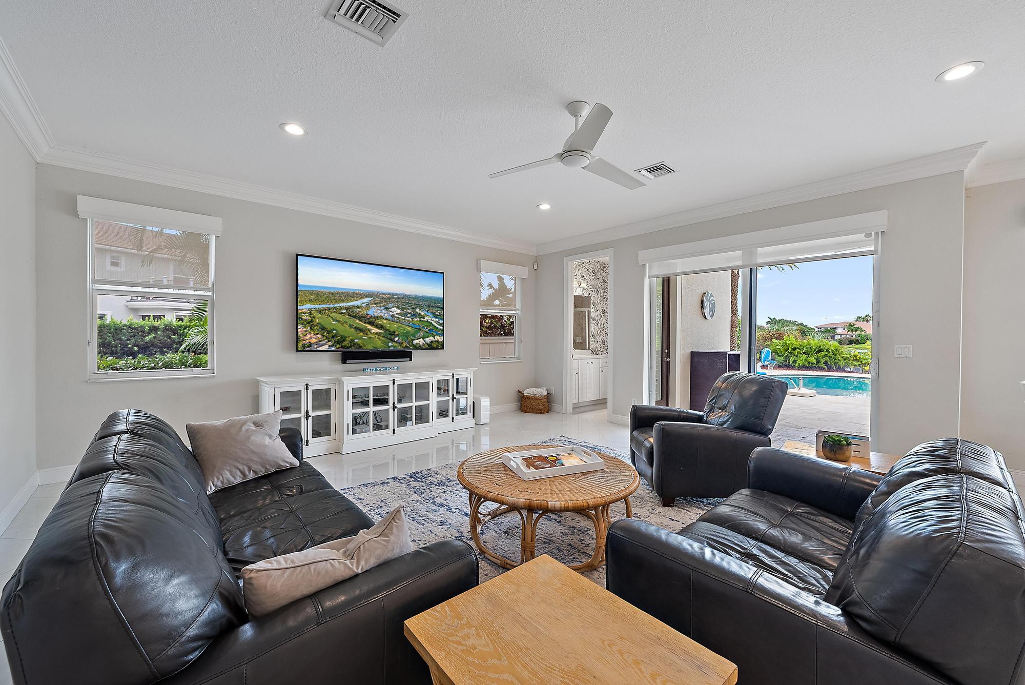 314 Rudder Cay Way Jupiter, FL 33458 - Photo 13 of 66 a living room with furniture and a flat screen tv