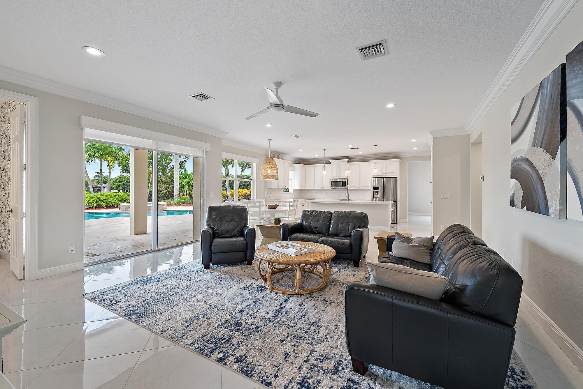 314 Rudder Cay Way Jupiter, FL 33458 - Photo 15 of 66 a living room with furniture and a large window
