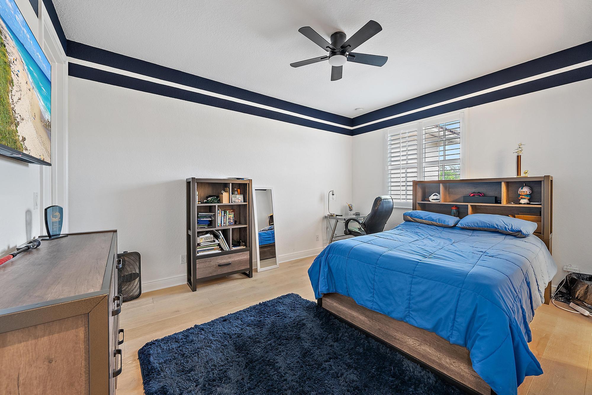 314 Rudder Cay Way Jupiter, FL 33458 - Photo 26 of 66 a bed room with a bed and a tv