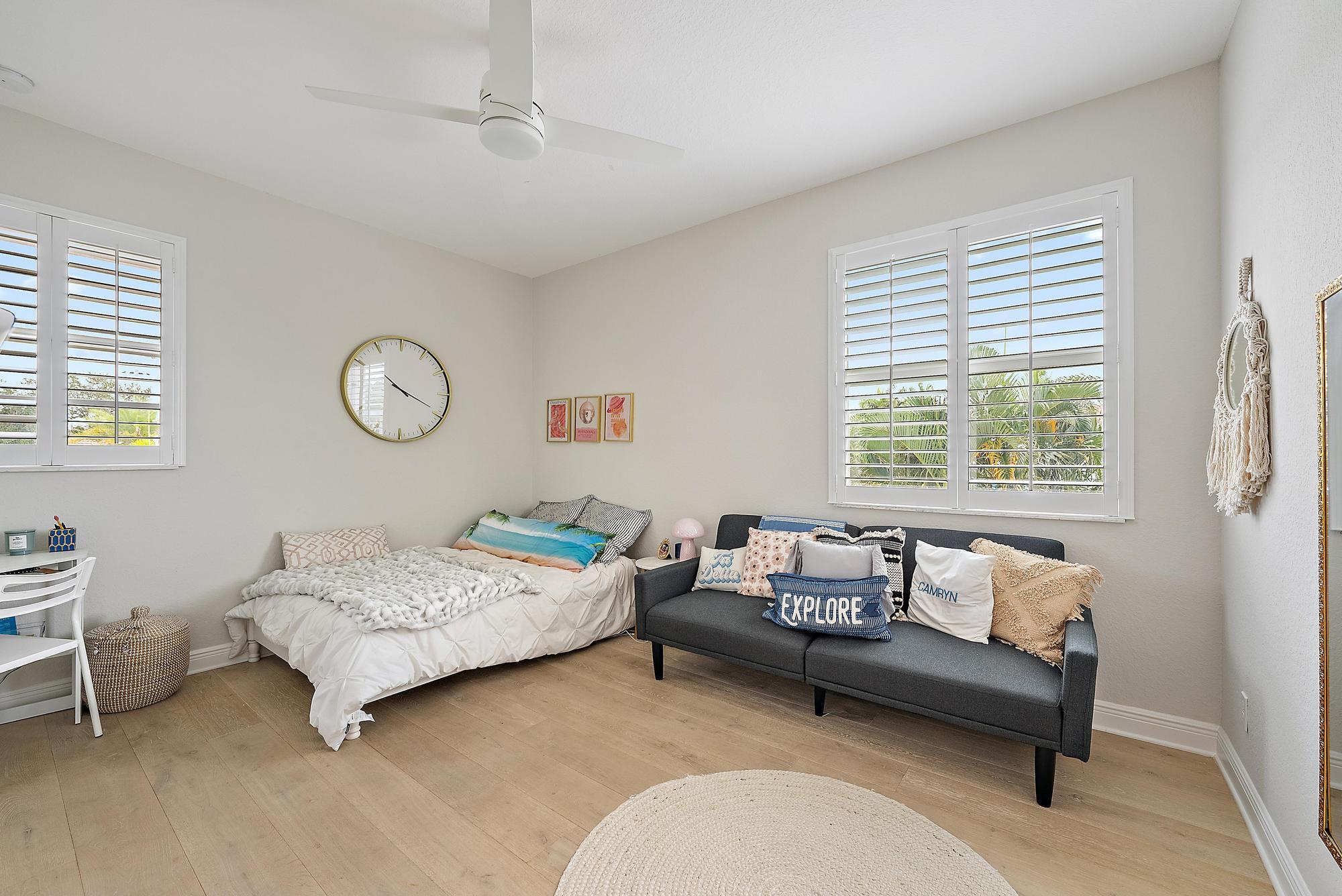 314 Rudder Cay Way Jupiter, FL 33458 - Photo 28 of 66 a bedroom with a bed and a couch