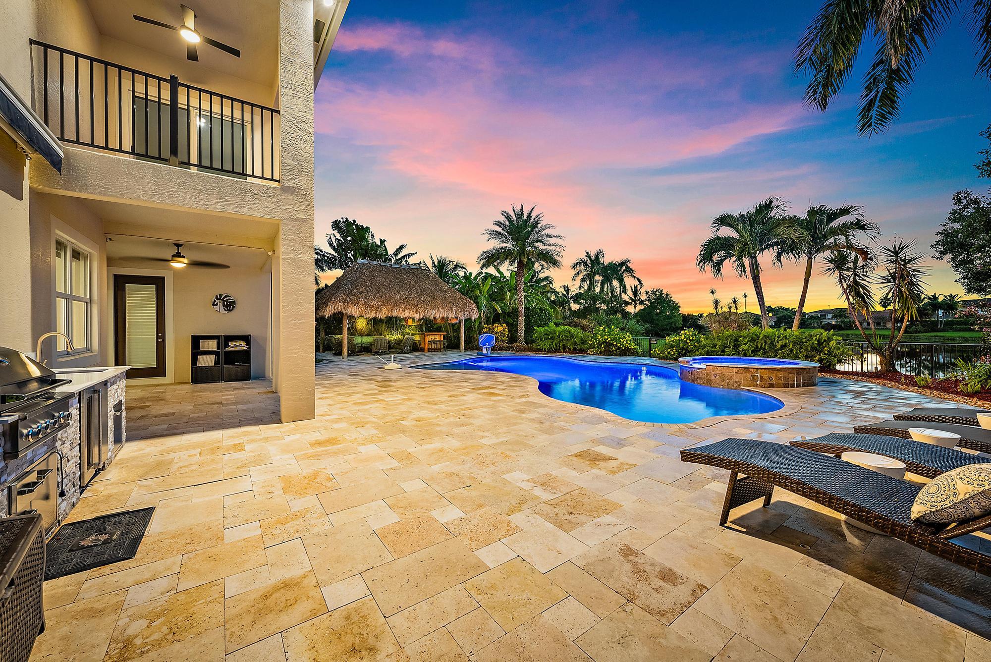 314 Rudder Cay Way Jupiter, FL 33458 - Photo 33 of 66 a swimming pool with outdoor seating