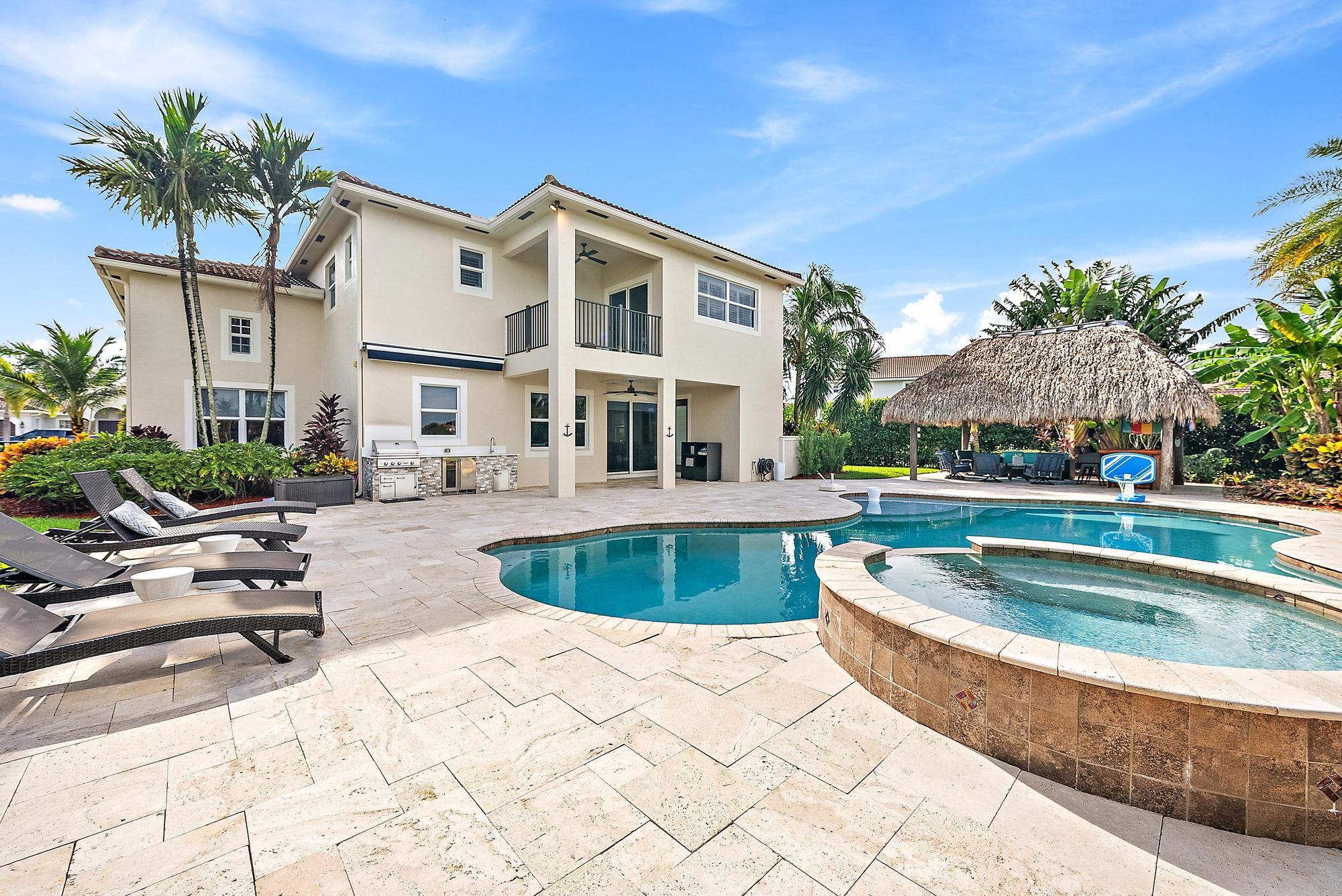 314 Rudder Cay Way Jupiter, FL 33458 - Photo 38 of 66 a view of outdoor space yard swimming pool and patio
