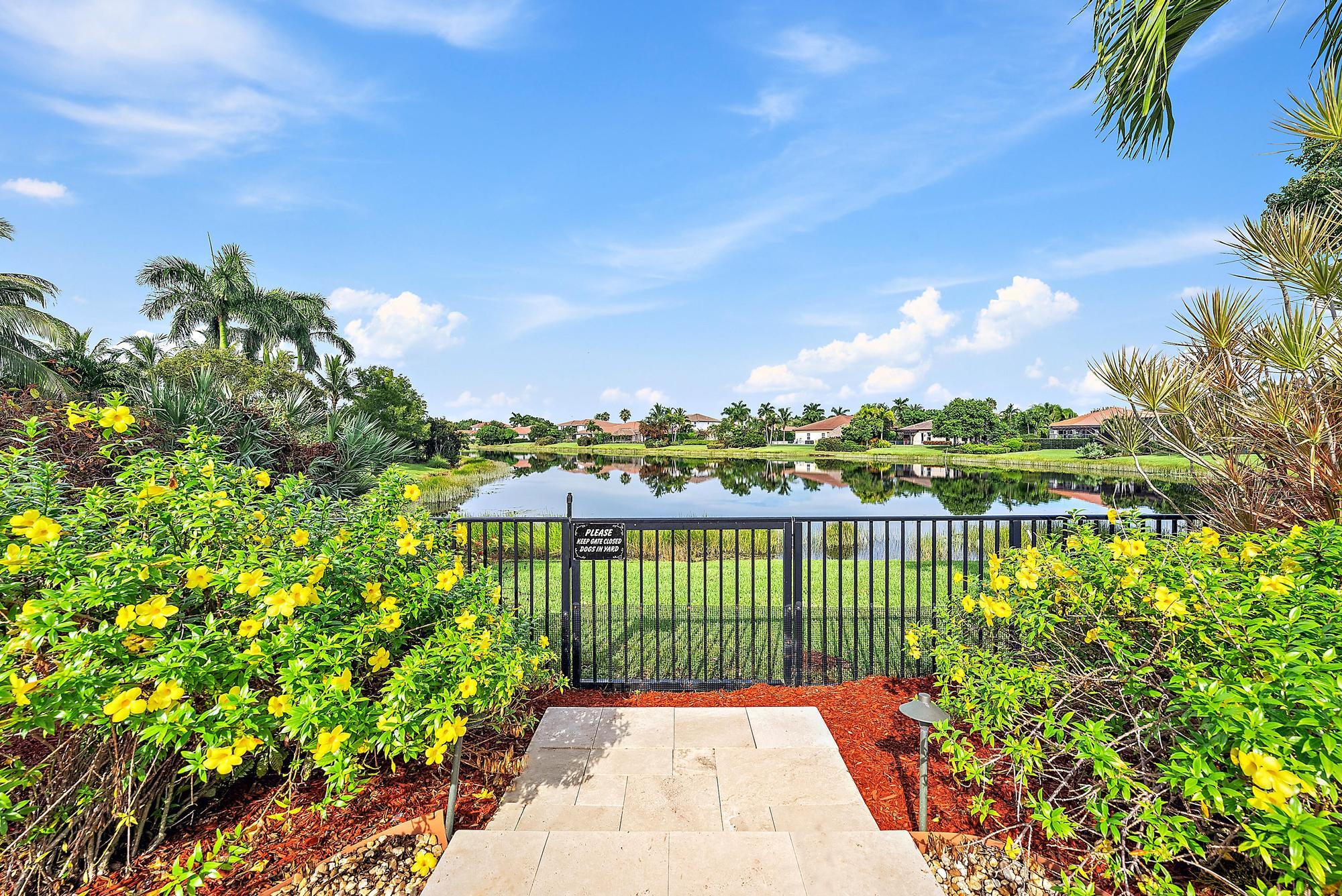 314 Rudder Cay Way Jupiter, FL 33458 - Photo 42 of 66 a view of a garden with a lake view