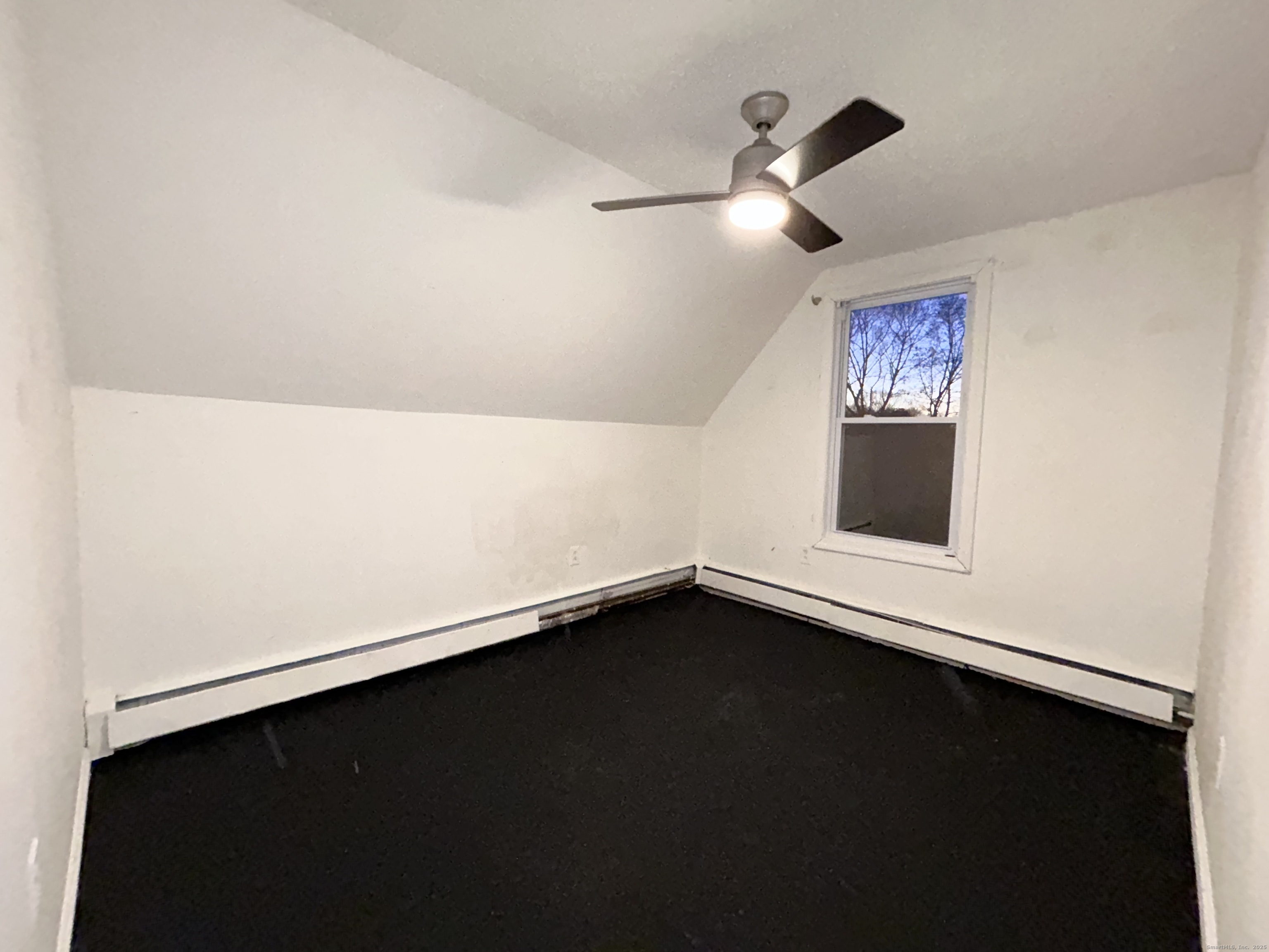 20 Hedge Avenue Norwich, CT 06360 - Photo 10 of 14 an empty room with a ceiling fan and a window