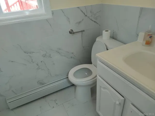 a view of a house with a small deck