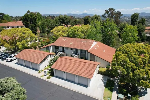 an aerial view of a house with a garden