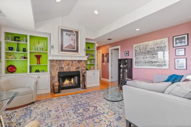 a living room with furniture and a fireplace