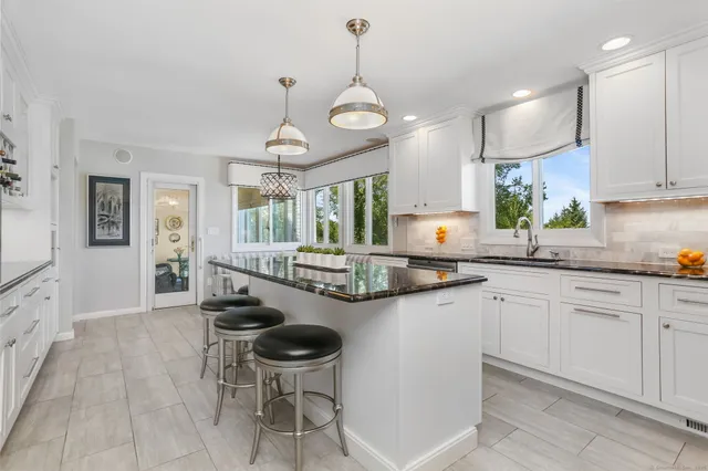 a kitchen with sink cabinets and window