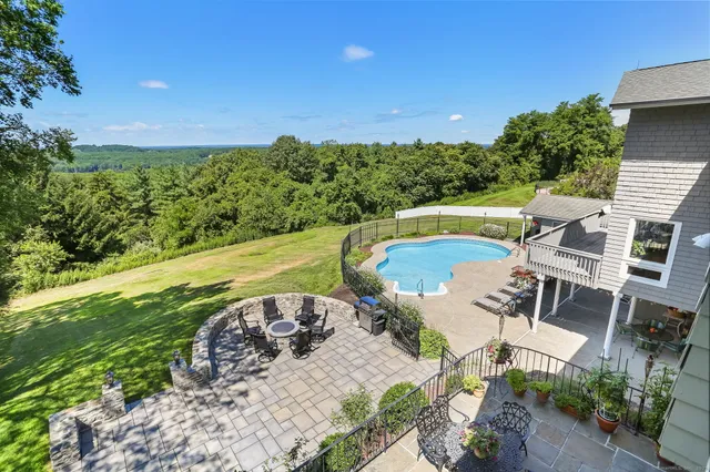 a view of a swimming pool with a patio
