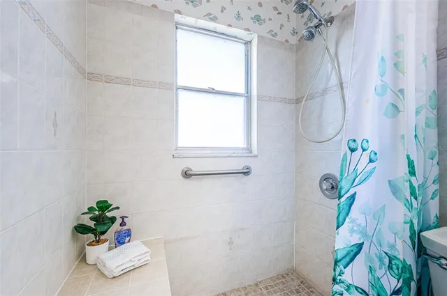 a front view of a house with parking space