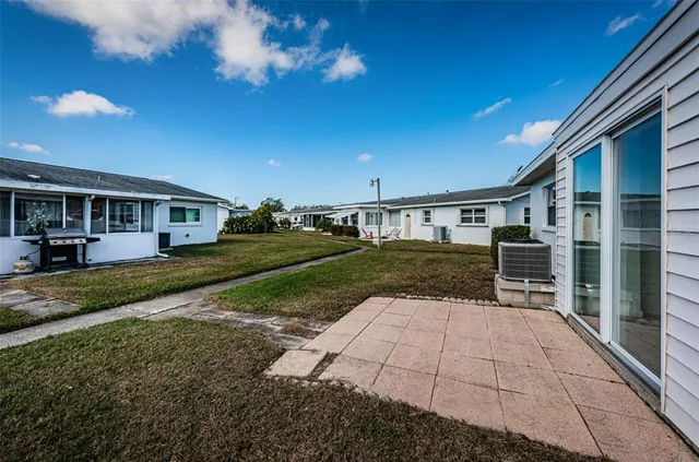 a view of a dining area with furniture window and wooden floor
