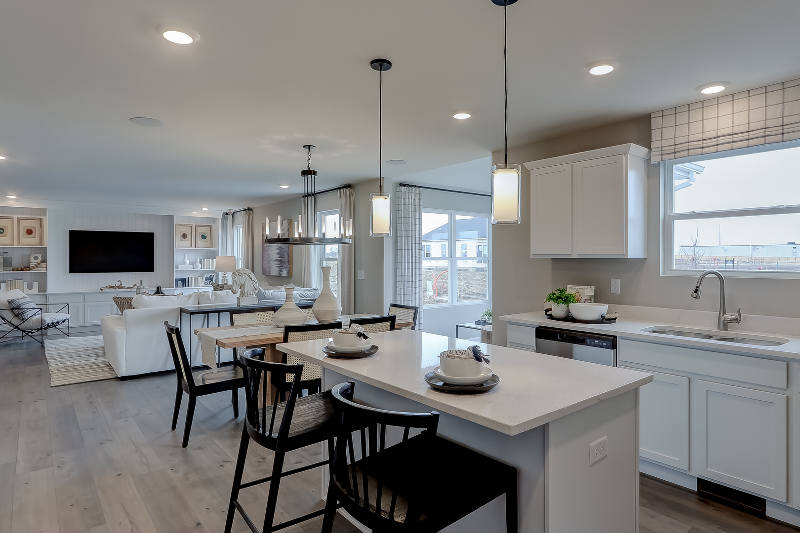 492 Endicott Road South Elgin, IL 60177 - Photo 14 of 30 a kitchen with a dining table chairs and white cabinets