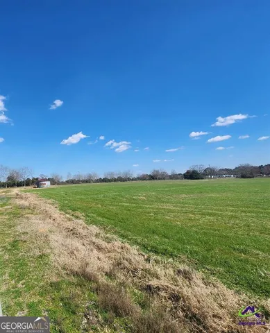a view of an ocean and yard