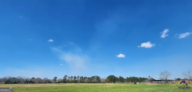 a view of houses with yard and ocean view