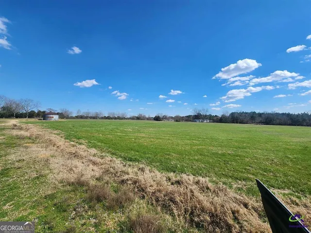 a view of backyard with deck