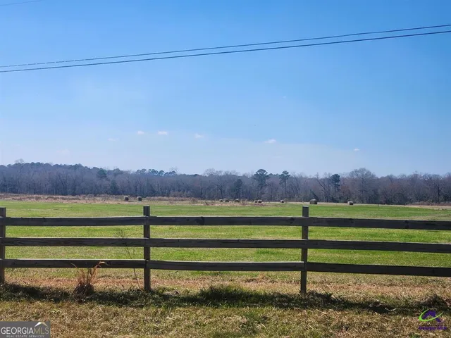 a view of a yard with a lake view