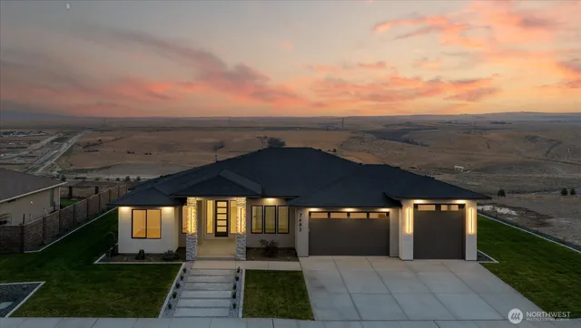 a view of a patio with chairs and a yard