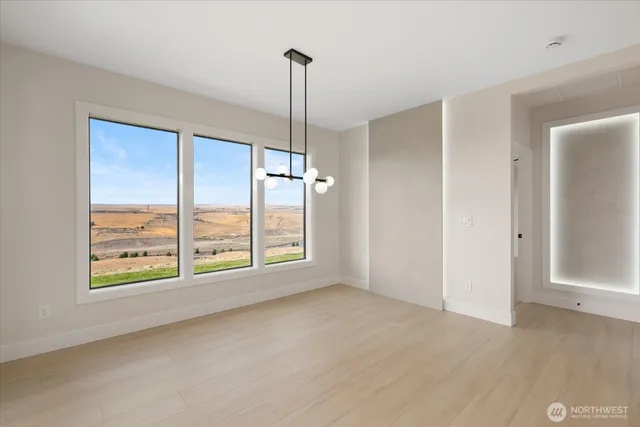a view of room with window and hardwood floor