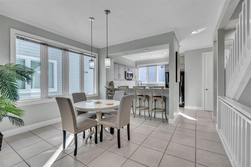 848 Evergreen Way Longboat Key, FL 34228 - Photo 9 of 66 a view of a dining room with furniture window and outside view