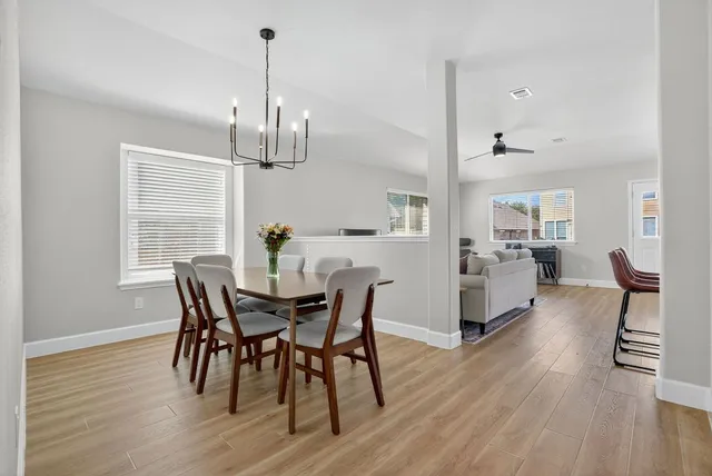 a view of a dining room with furniture window and wooden floor