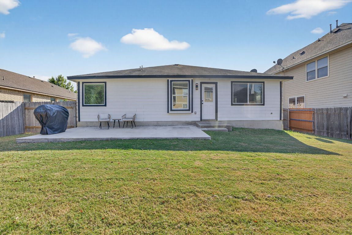 394 Verano Drive Kyle, TX 78640 - Photo 23 of 25 a swimming pool with outdoor seating and yard