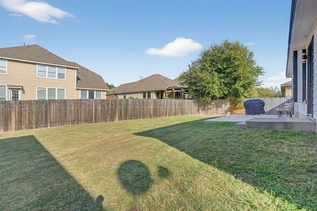 a swimming pool with wooden fence