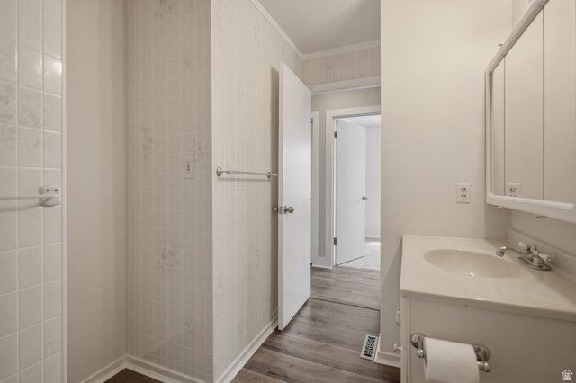 337 North Main Street Central Valley, UT 84754 - Photo 22 of 40 Half bathroom with ornamental molding, vanity, and dark wood-style floors