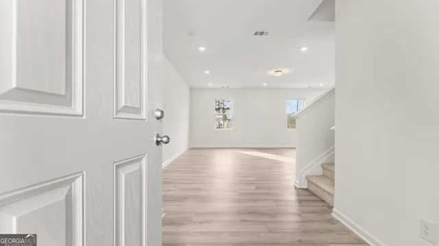 a view of kitchen with wooden floor