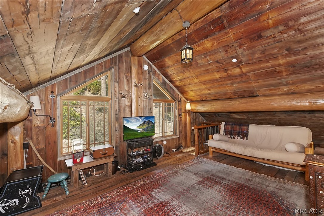 29632 Hook Creek Road Cedar Glen, CA 92321 - Photo 28 of 43 a living room with furniture a flat screen tv and a window