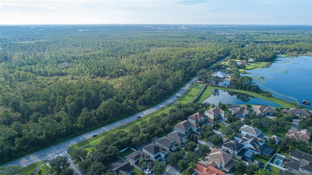 7545 Ficquette Road Windermere, FL 34786 - Photo 15 of 23 an aerial view of green landscape with trees and houses