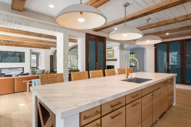 a view of a hallway with entryway wooden floor and front door