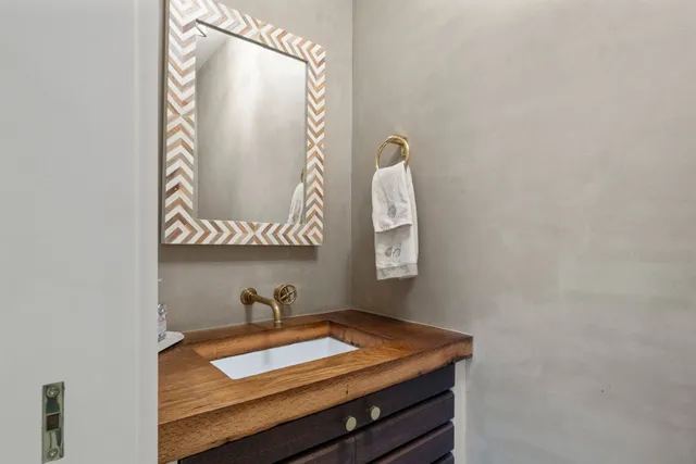 a living room with a fireplace furniture and a large window