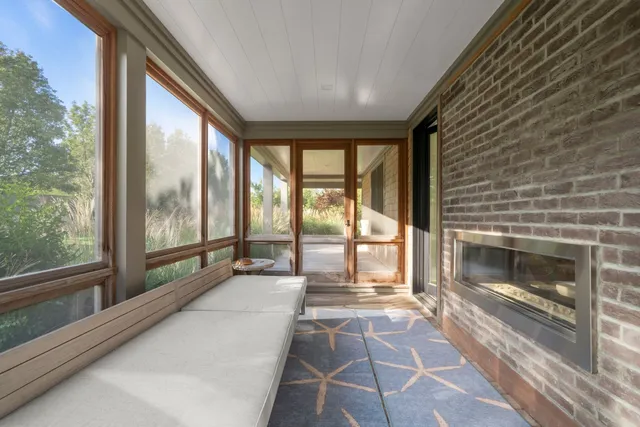 a bedroom with a large bed and a couch