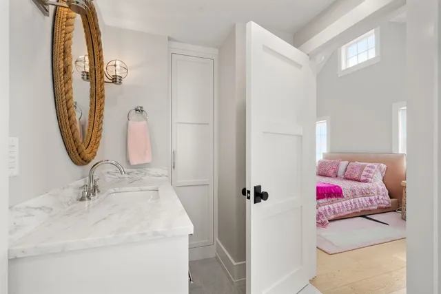 a bathroom with a shower and a glass door
