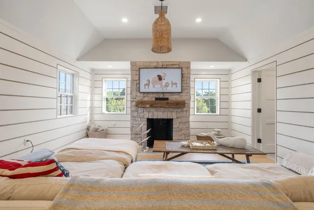 a bedroom with furniture and a window