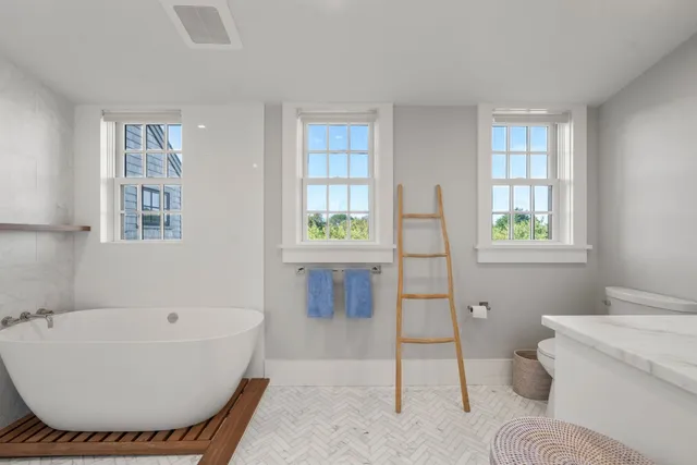 a bathroom with a bathtub and shower