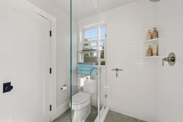 a living room with furniture rug and window