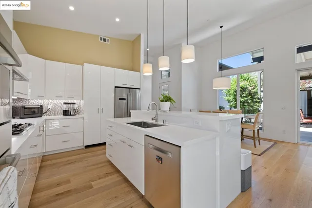 a large kitchen with a lot of counter space and a sink