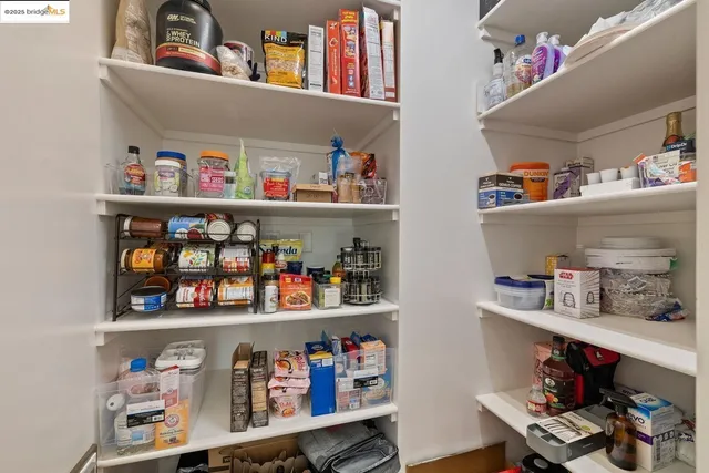 a shelf with cup and plates