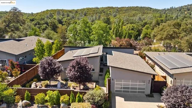 an aerial view of a house with a garden