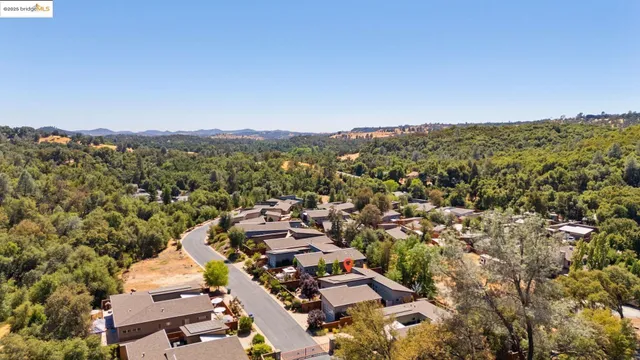 an aerial view of a house with a garden